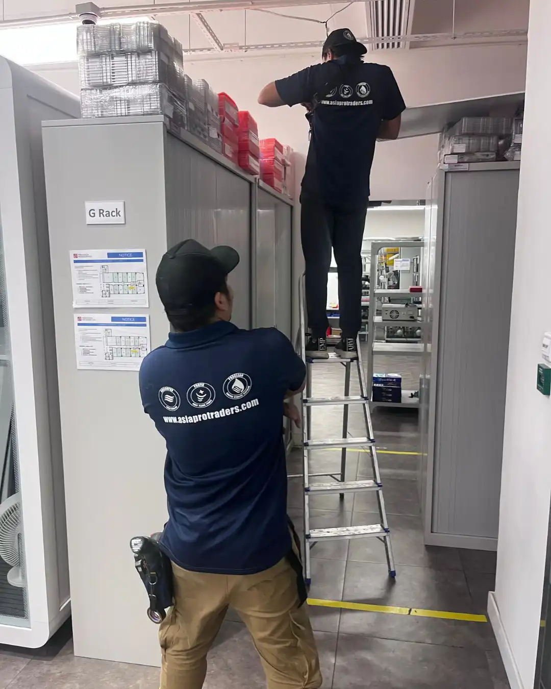 Proclean technicians servicing equipment in a storage and plant area of a commercial facility