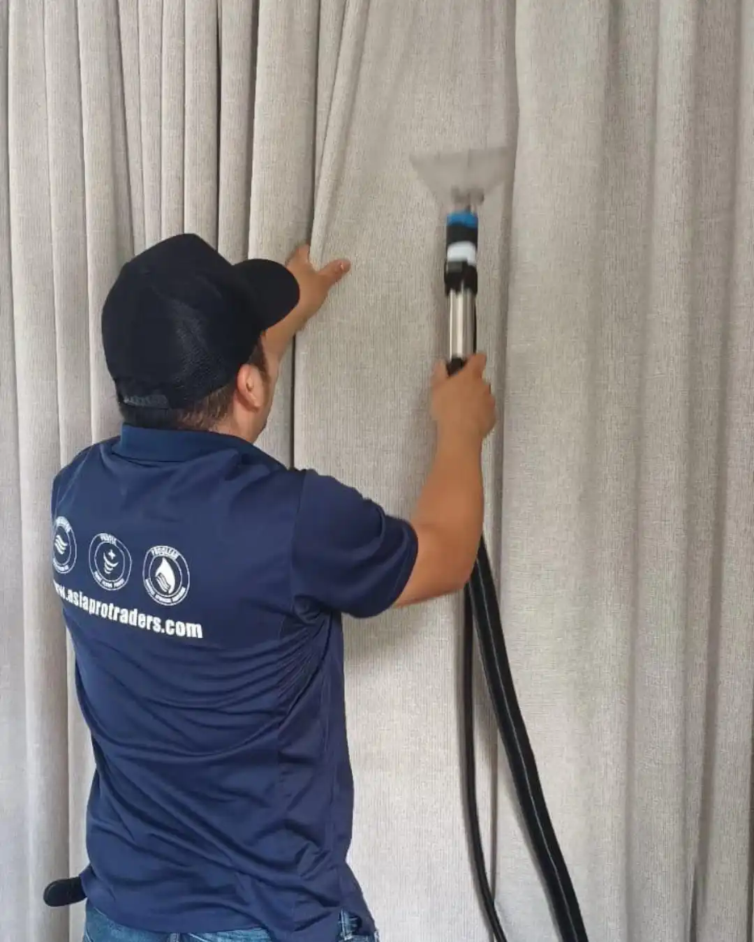 Fabric Cleaning in Hong Kong: A Deep Clean You Can Feel 2 Proclean technician steam cleaning curtains on the rail
