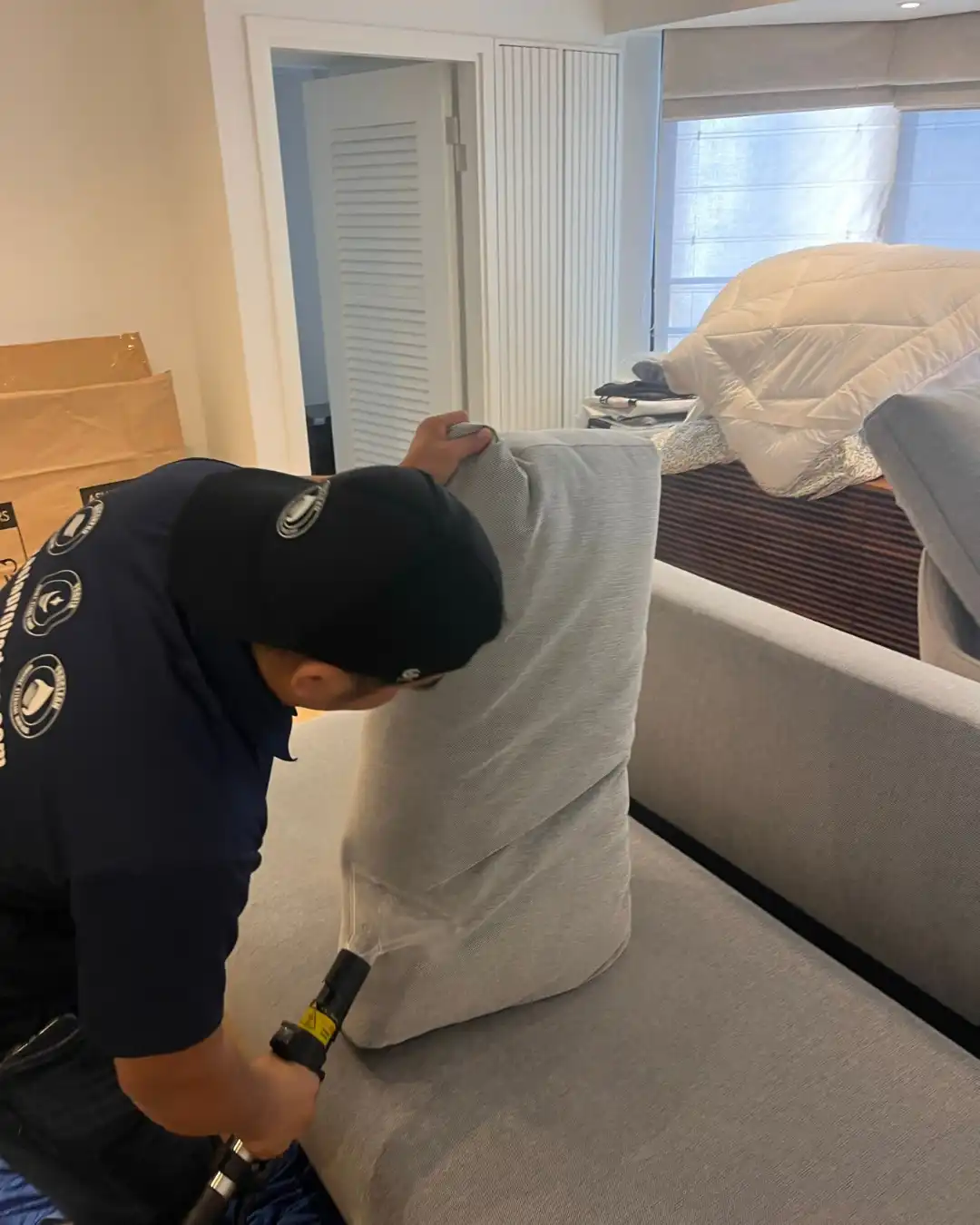 Fabric Cleaning in Hong Kong: A Deep Clean You Can Feel 3 Proclean technician cleaning a fabric sofa cushion in a Hong Kong living room