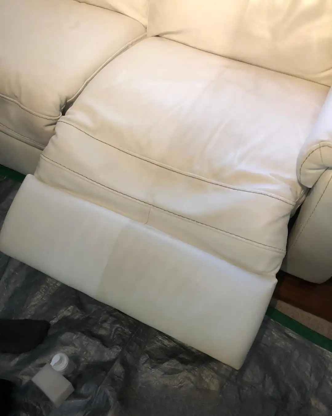 A cream leather sofa cushion after professional cleaning and conditioning