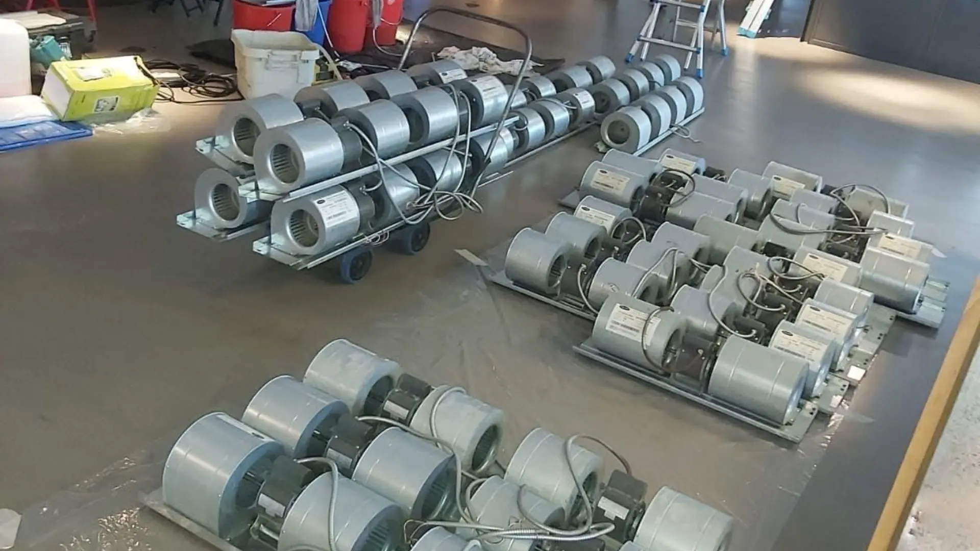 Fan Coil Unit and Duct Cleaning in Hong Kong: Better Air, Lower Bills 2 Rows of blower wheels removed from fan coil units and laid out for deep cleaning